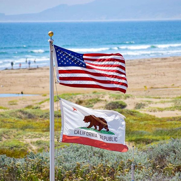 US and California Republic flags on the LA coast